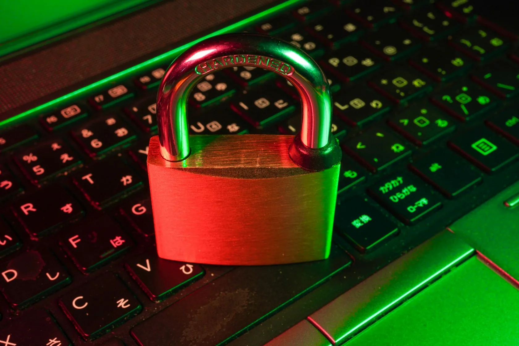 A padlock resting on a keyboard, lit hard